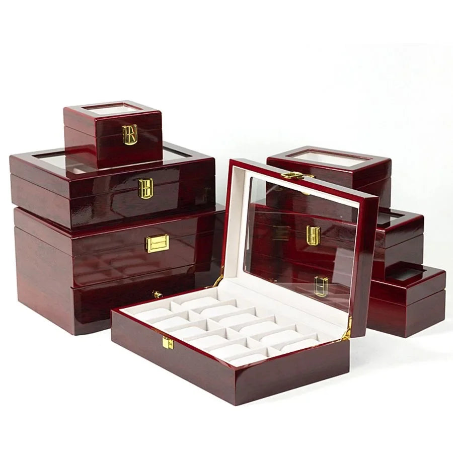 Black wooden watch box with 12 removable cushioned slots open on a dresser