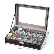 PU leather watch box organizer with multiple slots open on a wooden surface