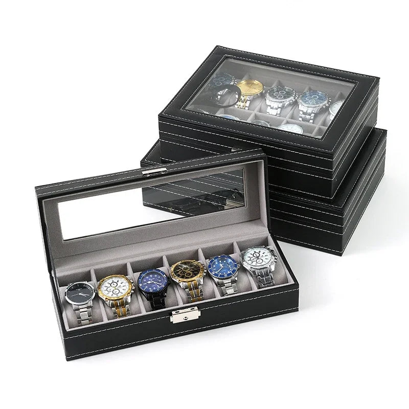 Close-up of antique-style watch box interior showing cushioned watch slots