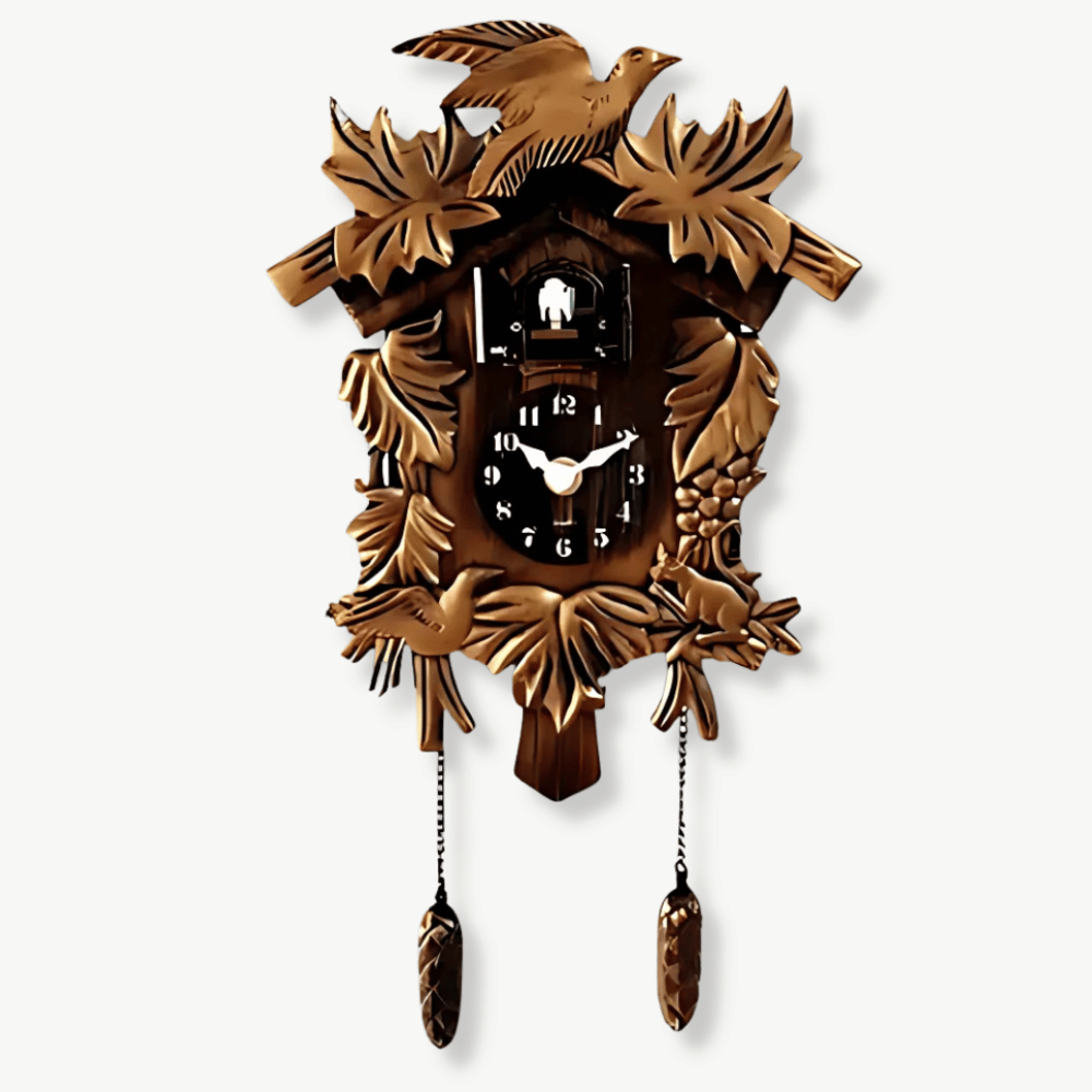 Antique cuckoo wall clock in Black Forest style mounted on a white wall