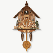 Traditional Black Forest chalet cuckoo wall clock with golden dial and pendulum