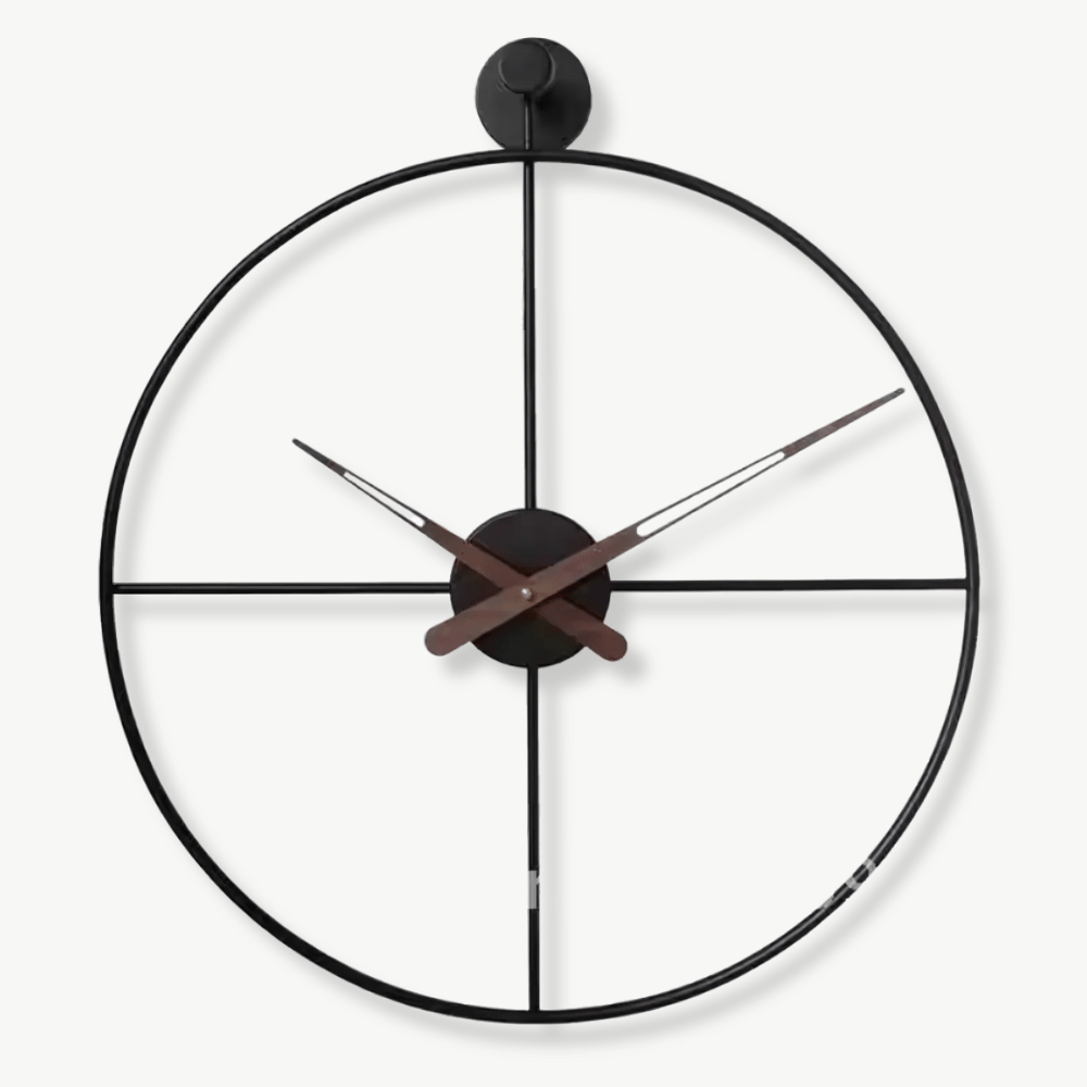 Crossed circle design metal wall clock in black, 50 cm, mounted on a white wall