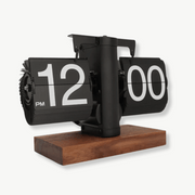 Automatic vintage flip clock in black walnut finish on a desk