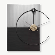 Large architect wall clock with metal frame hanging in a modern living room
