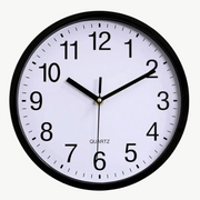 Classic silent analog wall clock in black, 10 inch diameter, mounted on a white wall
