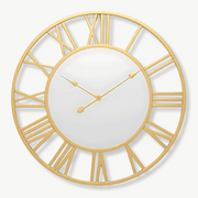 Roman numeral mirror wall clock in black metal, 60 cm, mounted on a living room wall