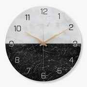 Modern marble effect wall clock in white and black on a living room wall
