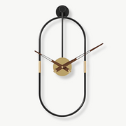 Oval design metal wall clock with geometric shape on a modern living room wall
