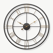 Industrial forged iron wall clock 50 cm on a brick wall