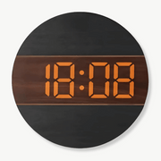 LED wood wall clock in natural bamboo finish mounted on a white wall
