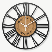 40 cm metal and cork wall clock with Roman numerals on a white wall