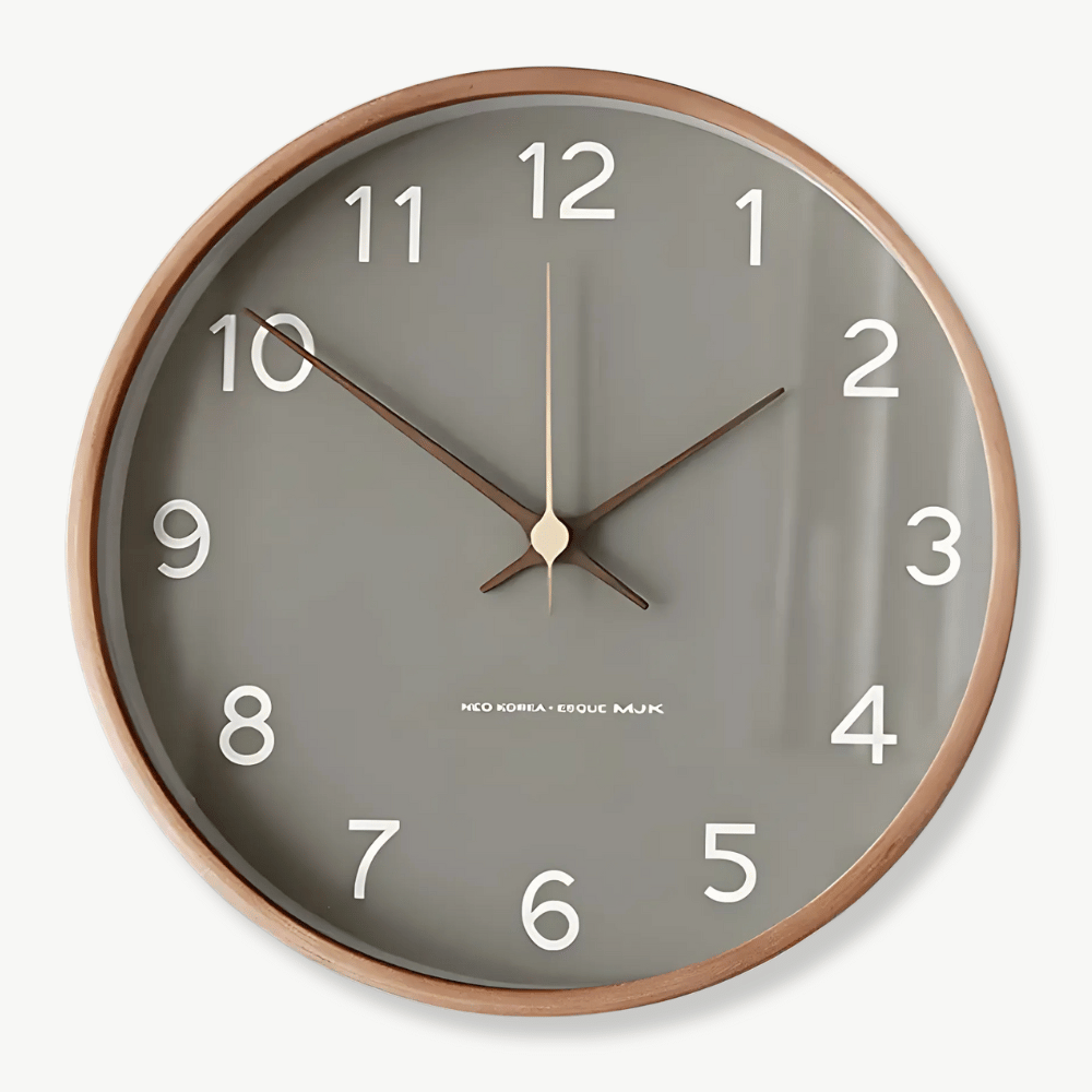 Scandinavian solid wood wall clock in white on a light living room wall