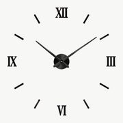 3D sticker wall clock in silver on a white living room wall