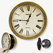 Secret compartment wall clock in gold finish showing hidden storage cavity open