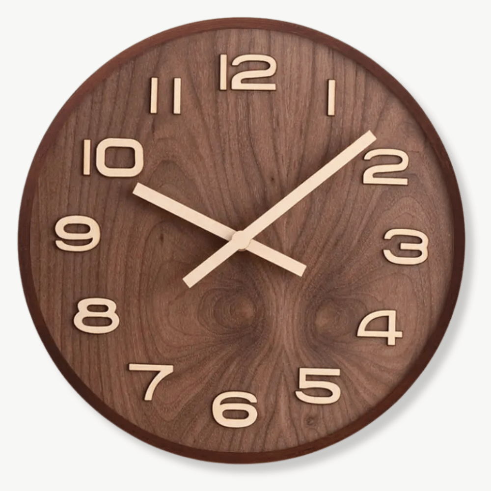 Handcrafted walnut wood wall clock with silent analog movement on a white wall