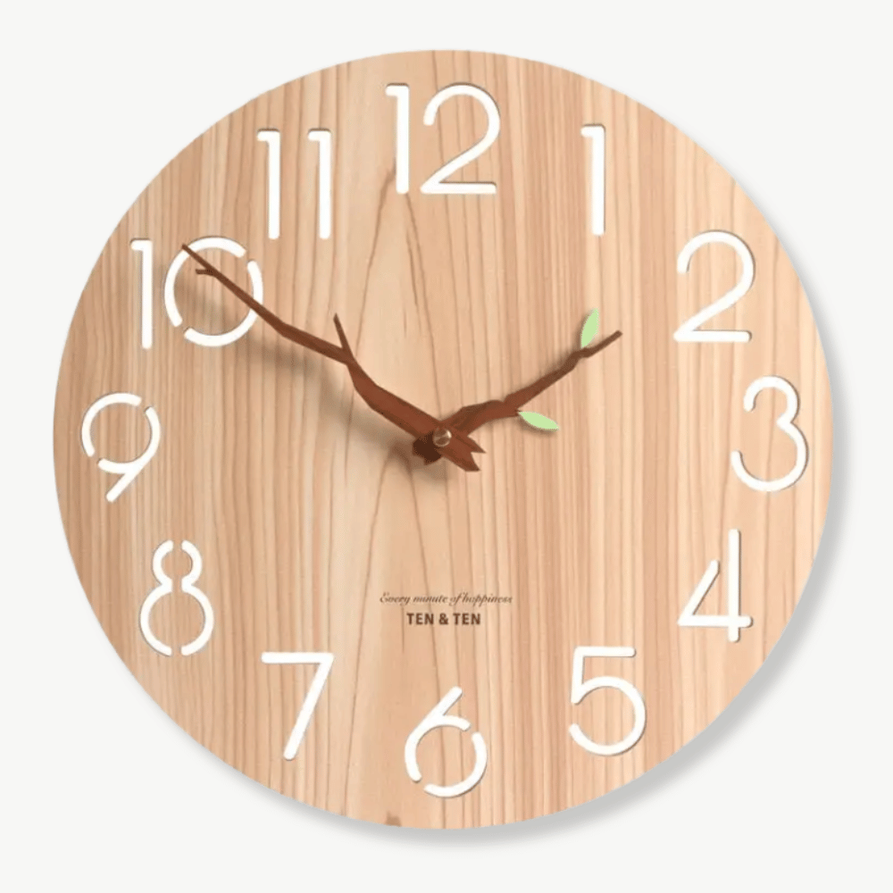 Bamboo wall clock natural wood with leaf accent on white wall