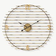 50 cm gold metal wall clock with silent quartz movement on a white wall
