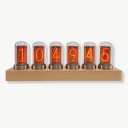 Modern Nixie tube clock with bamboo and wood frame on a desk