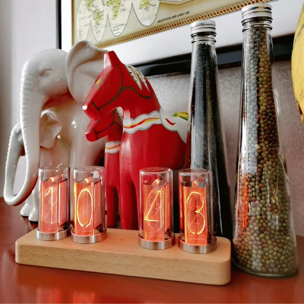 Nixie tube clock on office shelf with warm ambient lighting