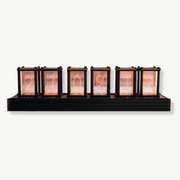 Retro Nixie tube desk clock in solid wood and metal showing glowing orange digits