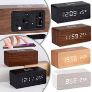 LED wood digital alarm clock with Qi wireless charger in brown finish on nightstand