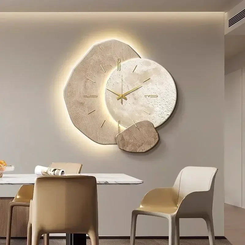 Modern LED wall clock with warm light strips on a living room wall