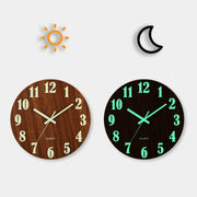 12-inch silent wooden wall clock with glow-in-the-dark numbers on a white wall