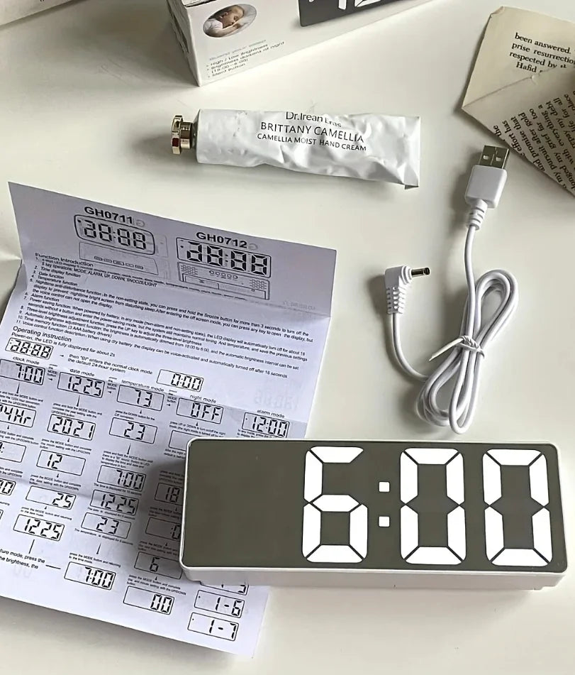 Close-up of LED mirror clock temperature and time readout
