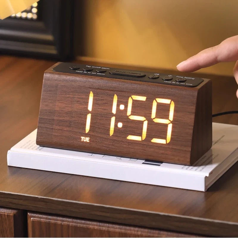 Retro wooden LED digital alarm clock on a desk in dark wood finish