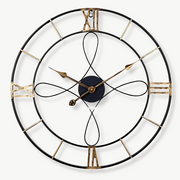 Black and gold forged iron wall clock 60 cm circular on a living room wall