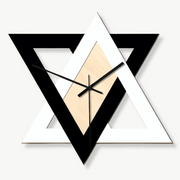 Black and white triangle wall clock with geometric design on a light wall