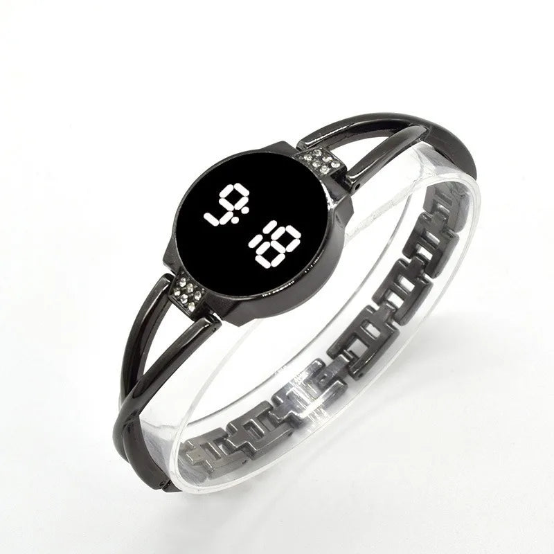 Close-up of LED touch display on women's elegant watch