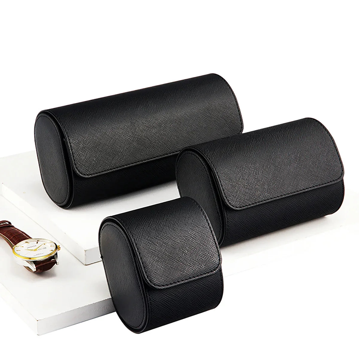 Open vintage leather watch roll showing padded watch compartments