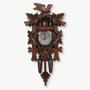 Traditional wooden cuckoo clock with European motifs in coffee-tone finish