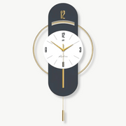 Modern geometric wall clock in bamboo metal and acrylic mounted on a white living room wall