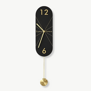 Designer pendulum wall clock with marble pattern in black on a living room wall