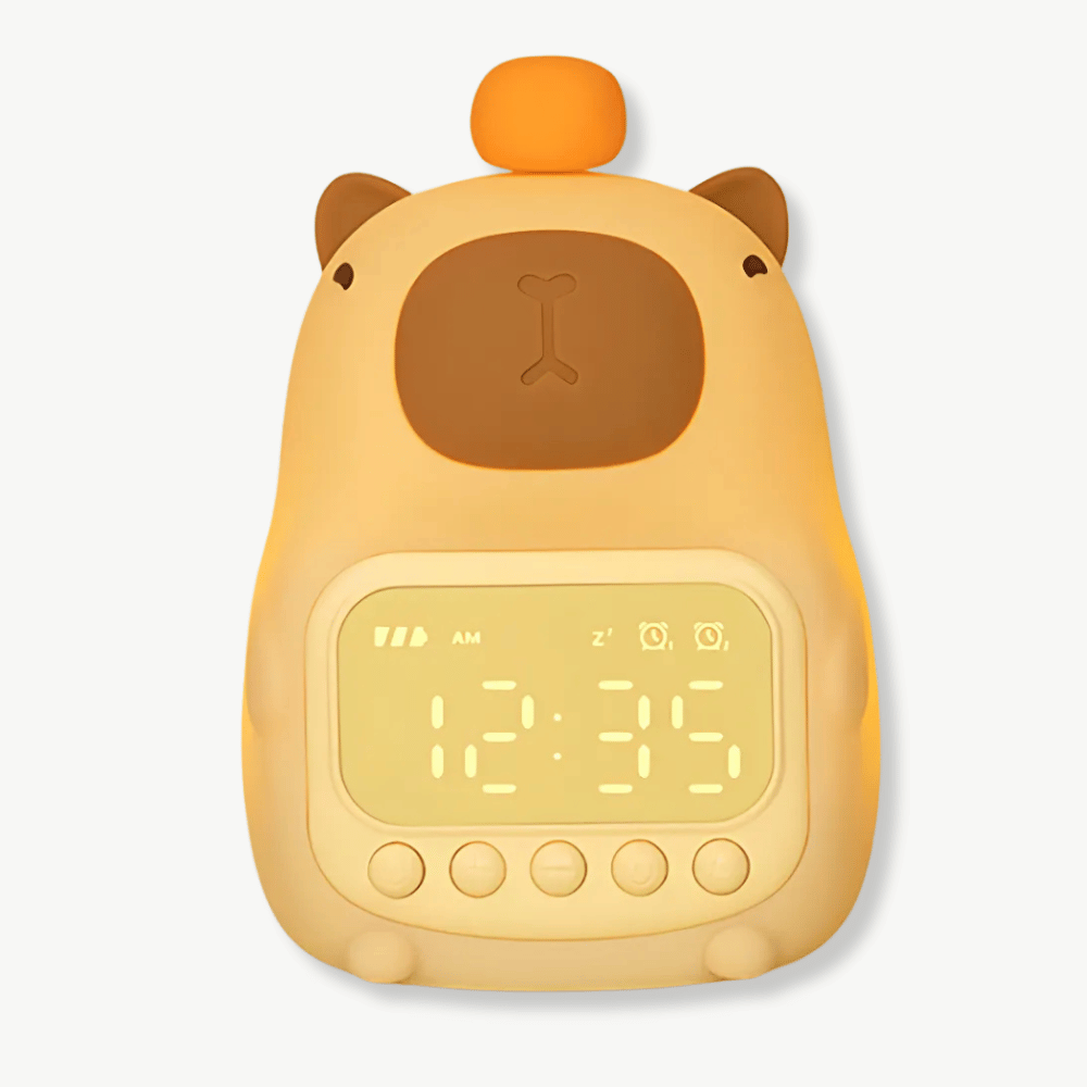 Capybara LED alarm clock with soft night light glowing on a bedside table