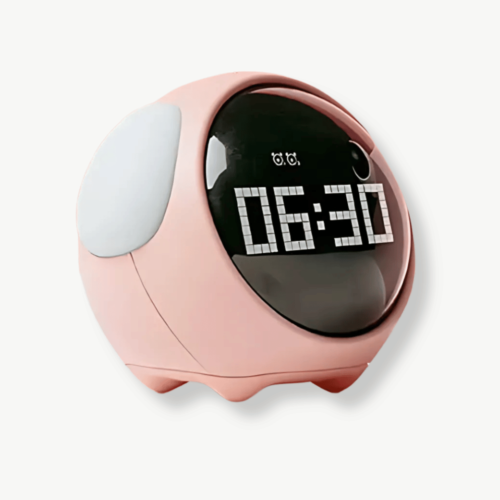 White emoji digital alarm clock with soft night light glow on bedside table