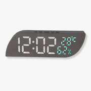 LED digital alarm clock with temperature and humidity display on white background