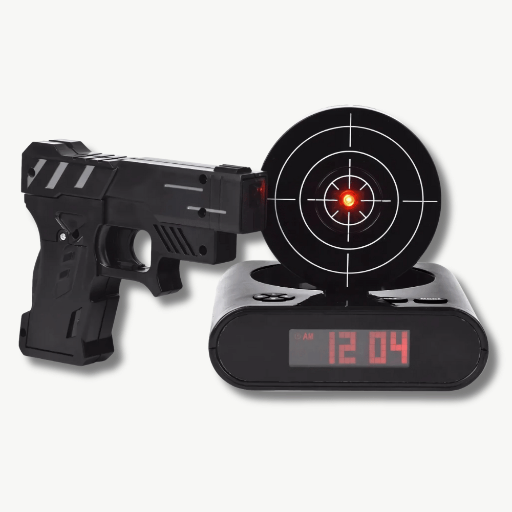 Target shooting alarm clock with laser gun on white background