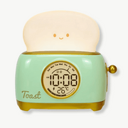 Cute toast-shaped alarm clock in green with LED display on a kids bedroom nightstand