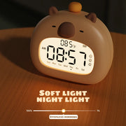 Kids LED alarm clock with night light in Panda style on a bedside table