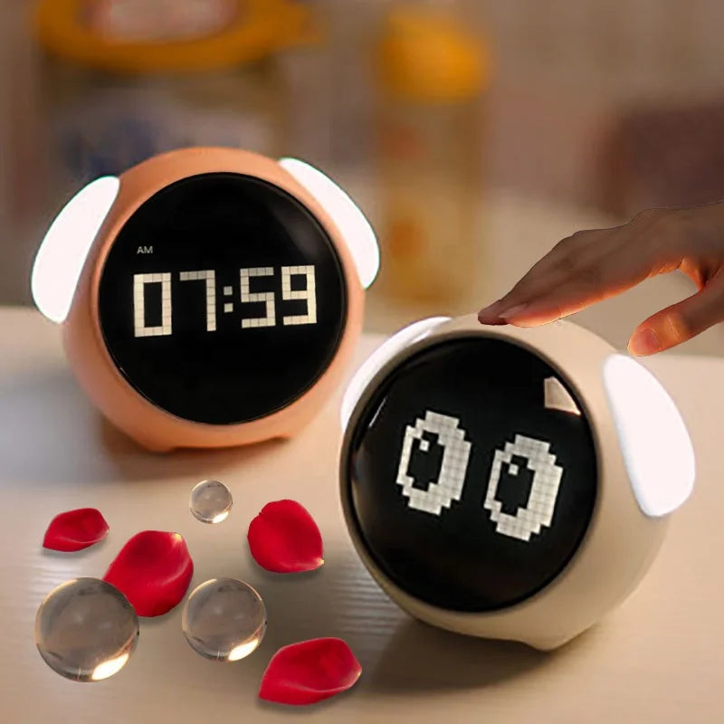 Pink kids LED digital alarm clock on a white nightstand