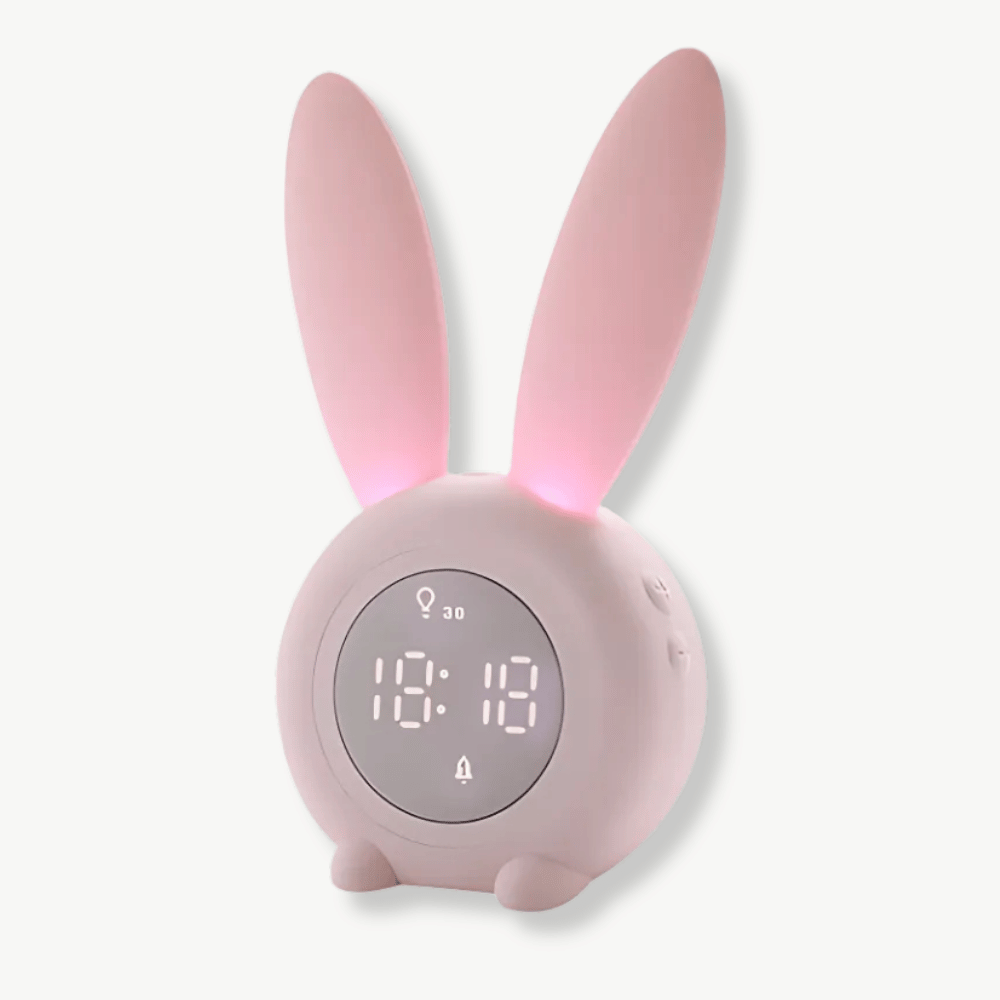 Bunny ear LED alarm clock in pink showing time date and temperature display