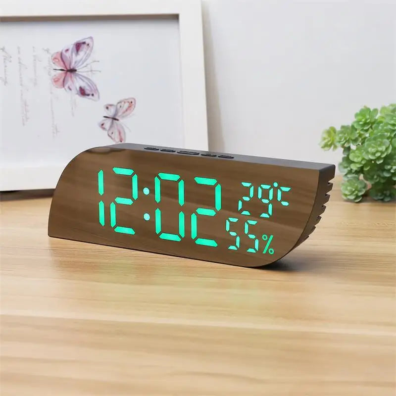 Modern bedside LED clock with calendar and humidity sensor close-up