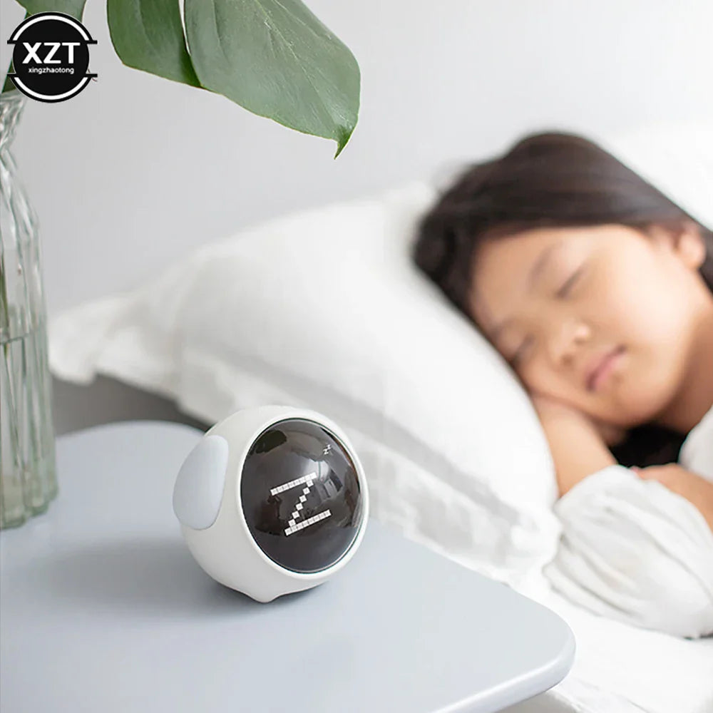 Pink emoji digital alarm clock showing digital time display