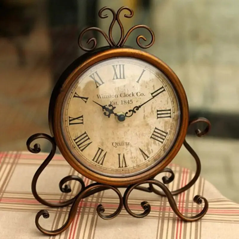Close-up of vintage bronze clock face with analog hands
