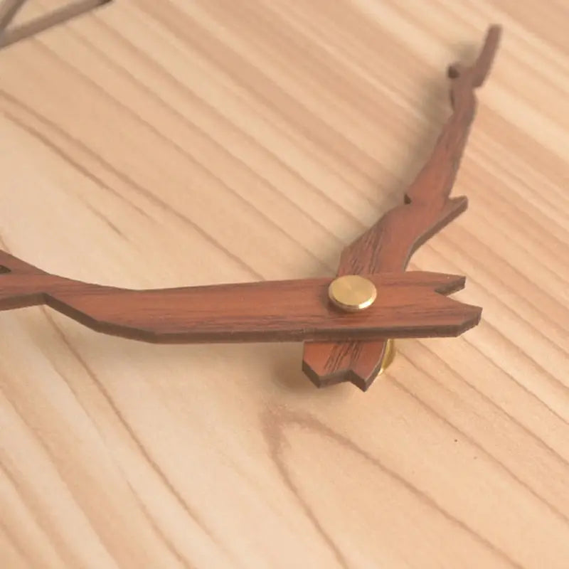 Natural wood bamboo wall clock hanging in modern living room