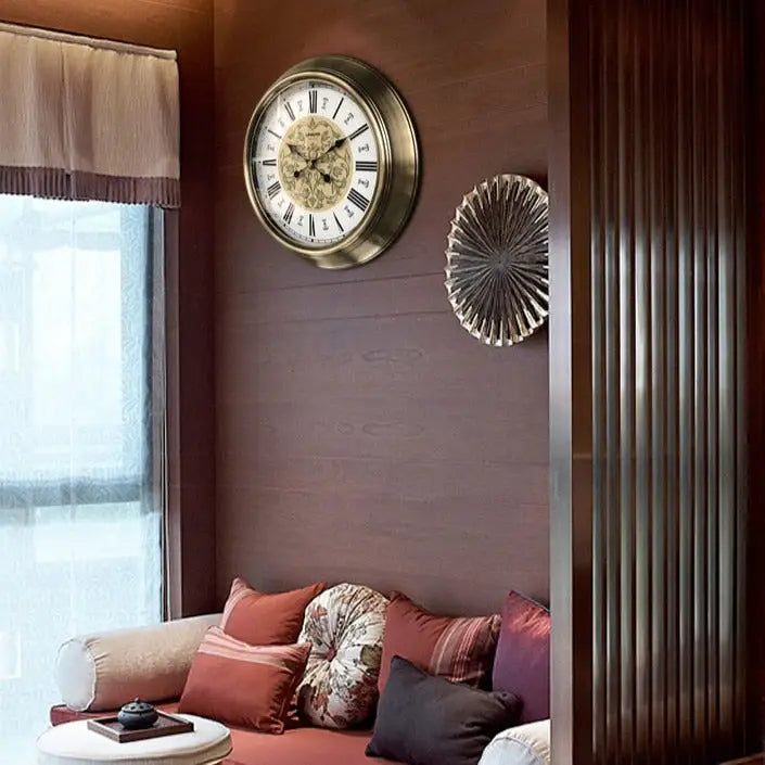 Close-up of silent quartz movement inside baroque metal wall clock