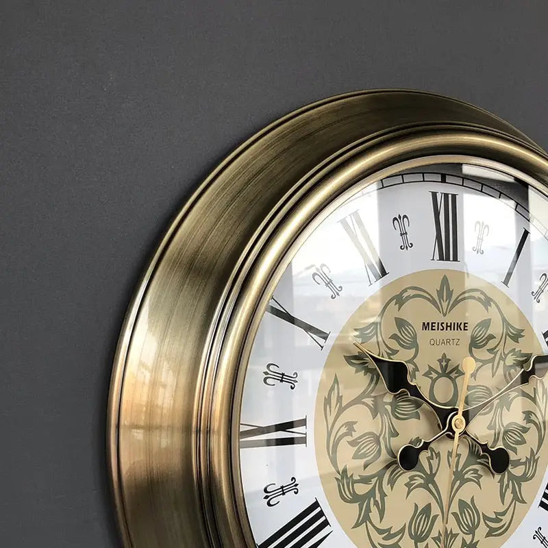 Baroque antique wall clock with hour and minute hands on glass mirror dial